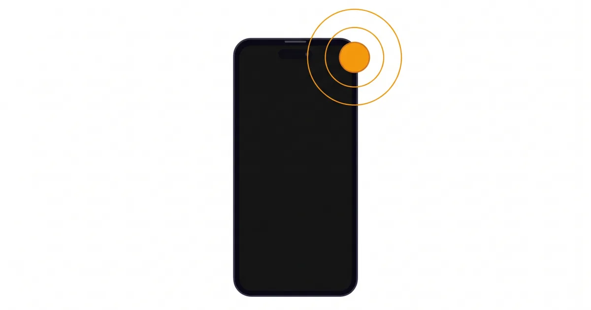 Un telefono con lo schermo spento e un pallino arancione che irradia due cerchi da un angolo